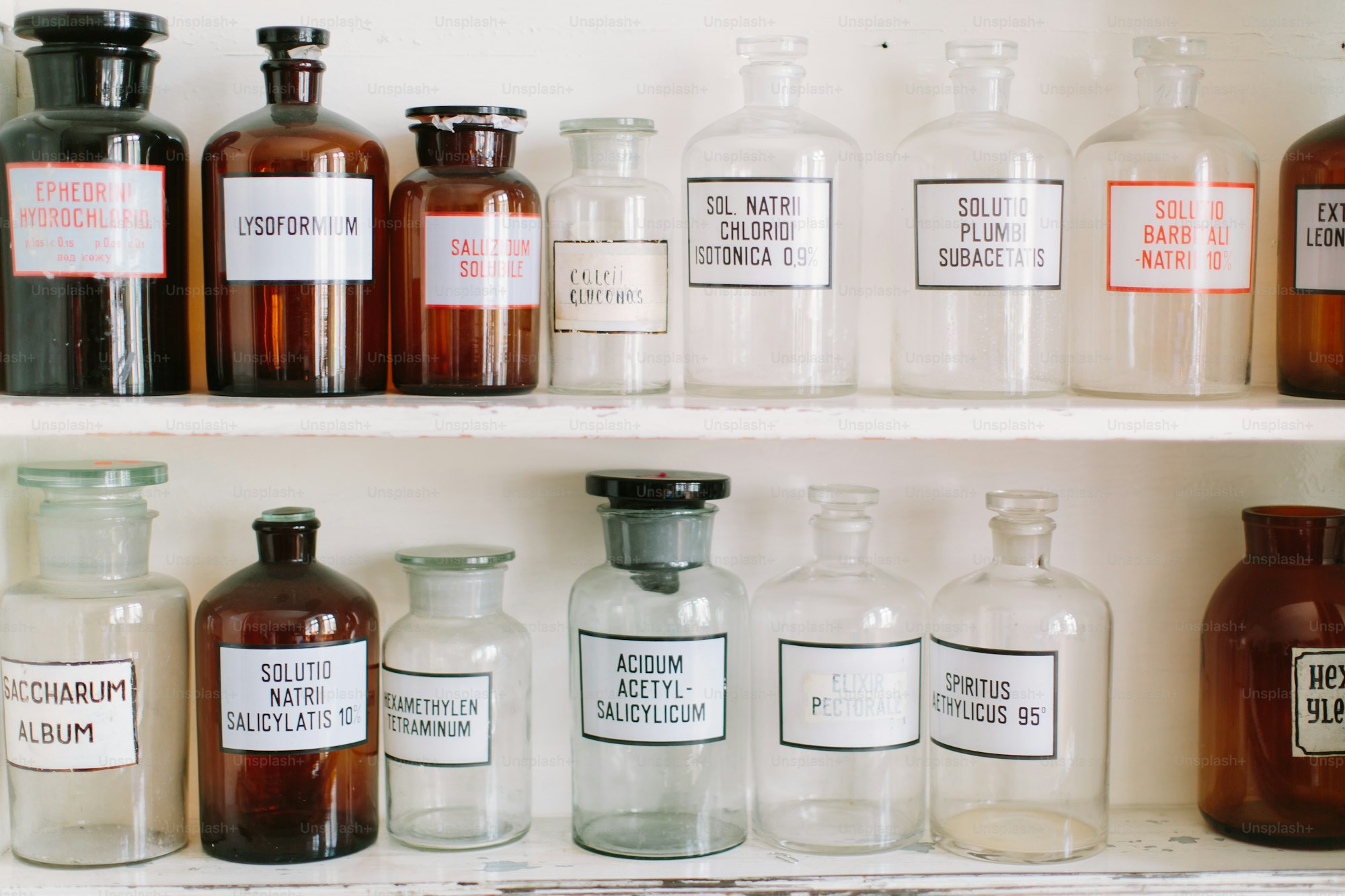Row of mouthwash bottles on a pharmacy shelf
