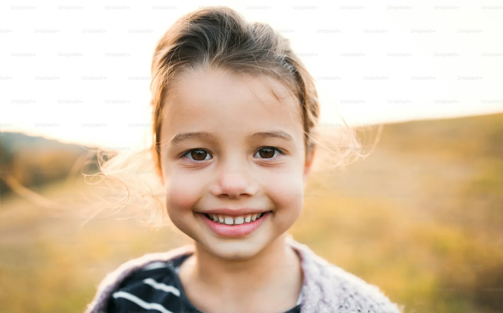 Child with front primary teeth missing — permanent teeth erupt into the gap