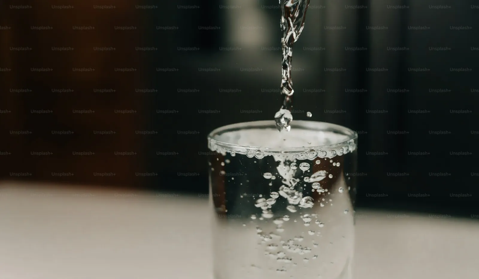 A glass of water and a toothbrush — the morning hygiene ritual